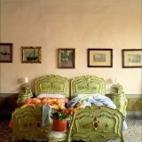 James Merrell bedroom peach walls green carved antique twin beds